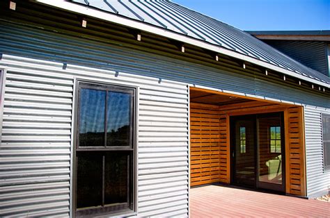 metal sheeting on house exterior|is metal siding durable.